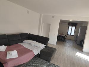 a living room with a couch and a table at Le dimore di Genny 1 in Medole