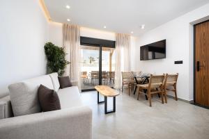 a living room with a couch and a table at Casarela in Marmari