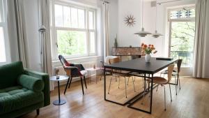 a living room with a dining room table and chairs at Authentic Amsterdam Apartment RAI in Amsterdam