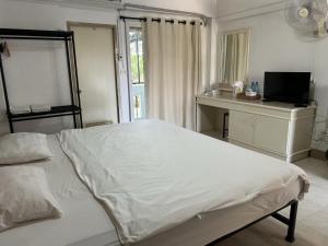 Postel nebo postele na pokoji v ubytování Phuviewplace Hotel - โรงแรมภูวิวเพลส