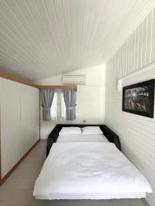 Postel nebo postele na pokoji v ubytování Azur Hotel