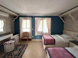 Postel nebo postele na pokoji v ubytování Azur Hotel
