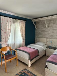 Postel nebo postele na pokoji v ubytování Azur Hotel