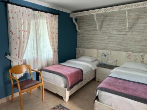 Postel nebo postele na pokoji v ubytování Azur Hotel