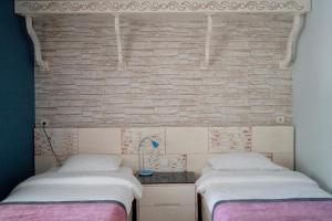 Postel nebo postele na pokoji v ubytování Azur Hotel