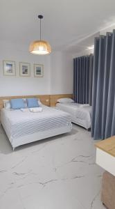 Katil atau katil-katil dalam bilik di Serendipity Apartment Radhime