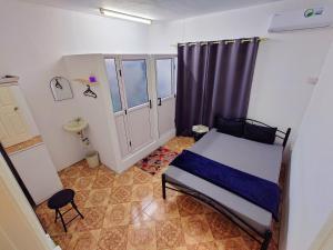 Una cama o camas en una habitación de Tropical Edge