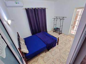 Postel nebo postele na pokoji v ubytování Tropical Edge