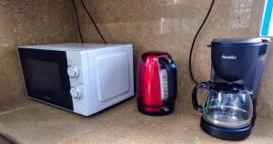 Tetera y cafetera en Tropical Edge