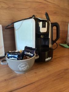 a coffee maker and a bowl on a table at Bungalow Jajce 1 Cottage in Jezero