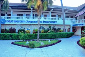 a building with a sign that reads best western javan beach resort at Best Western Jangwani Sea Breeze Resort in Dar es Salaam