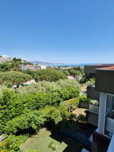 a view from the balcony of a building at Appartement vu mer et montagnes in Villeneuve-Loubet
