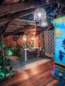 a room with a desk in a room with plants at Jeepney Siargao in General Luna +28 photos