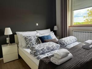 Postel nebo postele na pokoji v ubytování Elysian Apartments