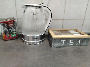 a blender sitting on a counter next to a box at Apartman 3R in Kragujevac