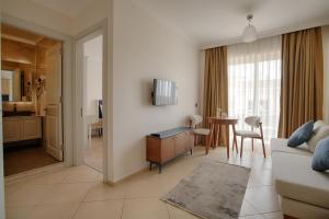 TV a/nebo společenská místnost v ubytování Kamer Exclusive Hotel & Suites