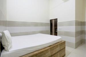 Postel nebo postele na pokoji v ubytování Hotel O YOUR RESIDENCY
