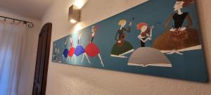 a painting of women hanging on a wall at DeTillierStudiò2 in Aosta