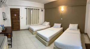 Postel nebo postele na pokoji v ubytování Phuviewplace Hotel - โรงแรมภูวิวเพลส