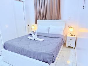 Postel nebo postele na pokoji v ubytování White Gorf Hotel