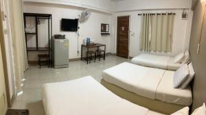 Postel nebo postele na pokoji v ubytování Phuviewplace Hotel - โรงแรมภูวิวเพลส