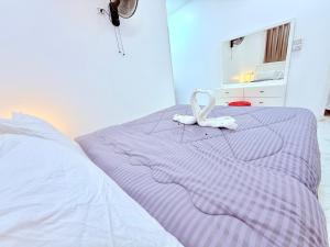 Postel nebo postele na pokoji v ubytování White Gorf Hotel
