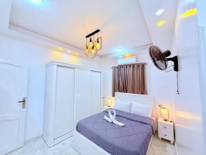 Postel nebo postele na pokoji v ubytování White Gorf Hotel