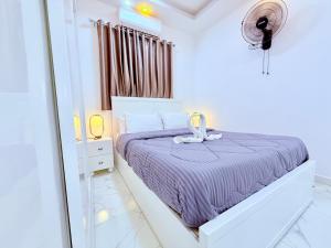 Postel nebo postele na pokoji v ubytování White Gorf Hotel