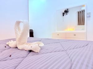 Postel nebo postele na pokoji v ubytování White Gorf Hotel