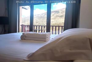 A bed or beds in a room at AC Apartaments Suite