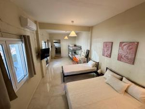 Ένα ή περισσότερα κρεβάτια σε δωμάτιο στο Seaside Apartments & Rooms Kampouri