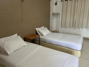 Postel nebo postele na pokoji v ubytování Phuviewplace Hotel - โรงแรมภูวิวเพลส