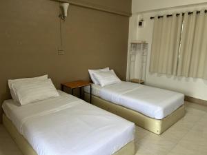 Postel nebo postele na pokoji v ubytování Phuviewplace Hotel - โรงแรมภูวิวเพลส