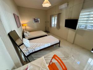 Ένα ή περισσότερα κρεβάτια σε δωμάτιο στο Seaside Apartments & Rooms Kampouri