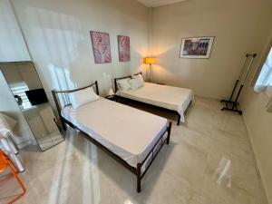 Ένα ή περισσότερα κρεβάτια σε δωμάτιο στο Seaside Apartments & Rooms Kampouri