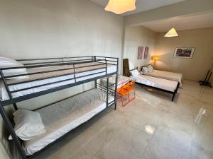 Ένα ή περισσότερα κρεβάτια σε δωμάτιο στο Seaside Apartments & Rooms Kampouri