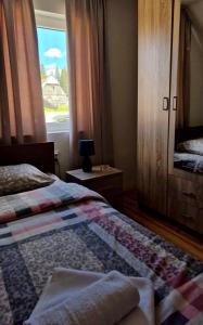 Postel nebo postele na pokoji v ubytování Sobe Baranin Zabljak