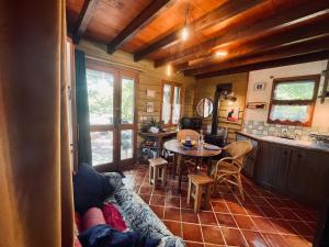 a living room with a couch and a table at Le Perce Neige in Durbans