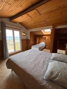 Postel nebo postele na pokoji v ubytování Le Surplage