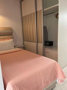 a bedroom with a bed and a large mirror at Maniatis Garden in Achladies