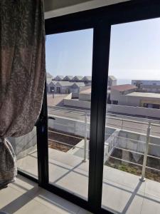 a room with a window looking out at an airport at 6 on Sunset Valley in Khomas Region