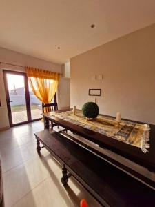 a ping pong table in a room with a window at 6 on Sunset Valley in Khomas Region