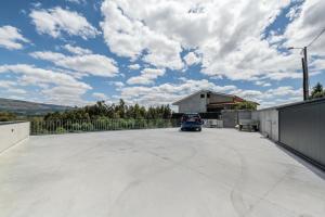 a car is parked in a parking lot at Casa do Horizonte in Vieira do Minho