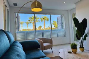 Posezení v ubytování Luxe appartement met jacuzzi, uitzicht & zwembaden