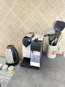 a coffee maker sitting on top of a counter at Apartments Mia Patria in Ulcinj