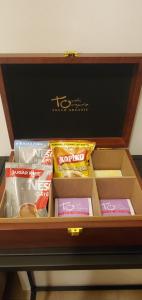 a drawer full of snacks in a wooden box at 81 Newport Studio C5 5i near NAIA T3 Pool and Balcony in Manila