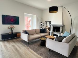 a living room with a couch and a fireplace at Appartement Villa Parco Ameno in Germignaga