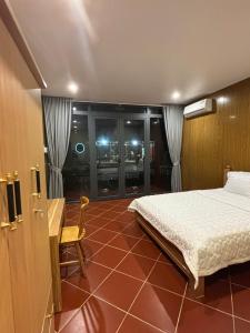 Postel nebo postele na pokoji v ubytování Homestay Xóm Quê