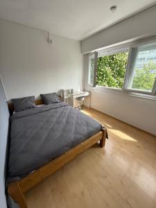 Ένα ή περισσότερα κρεβάτια σε δωμάτιο στο 4 bedroom apartment