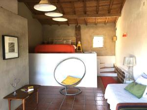 En eller flere senge i et værelse på HORTA do RAMALHAÕ